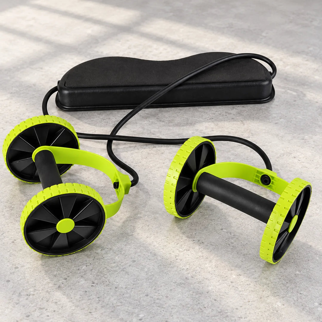 Revoflex green and black four-wheel exercise set with black foot pad and resistance cords on a home gym floor.