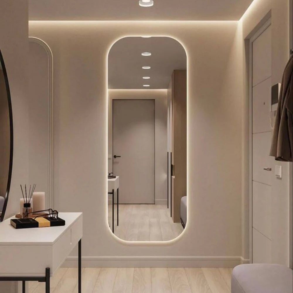 Arched full length LED mirror with warm light in entryway dressing area