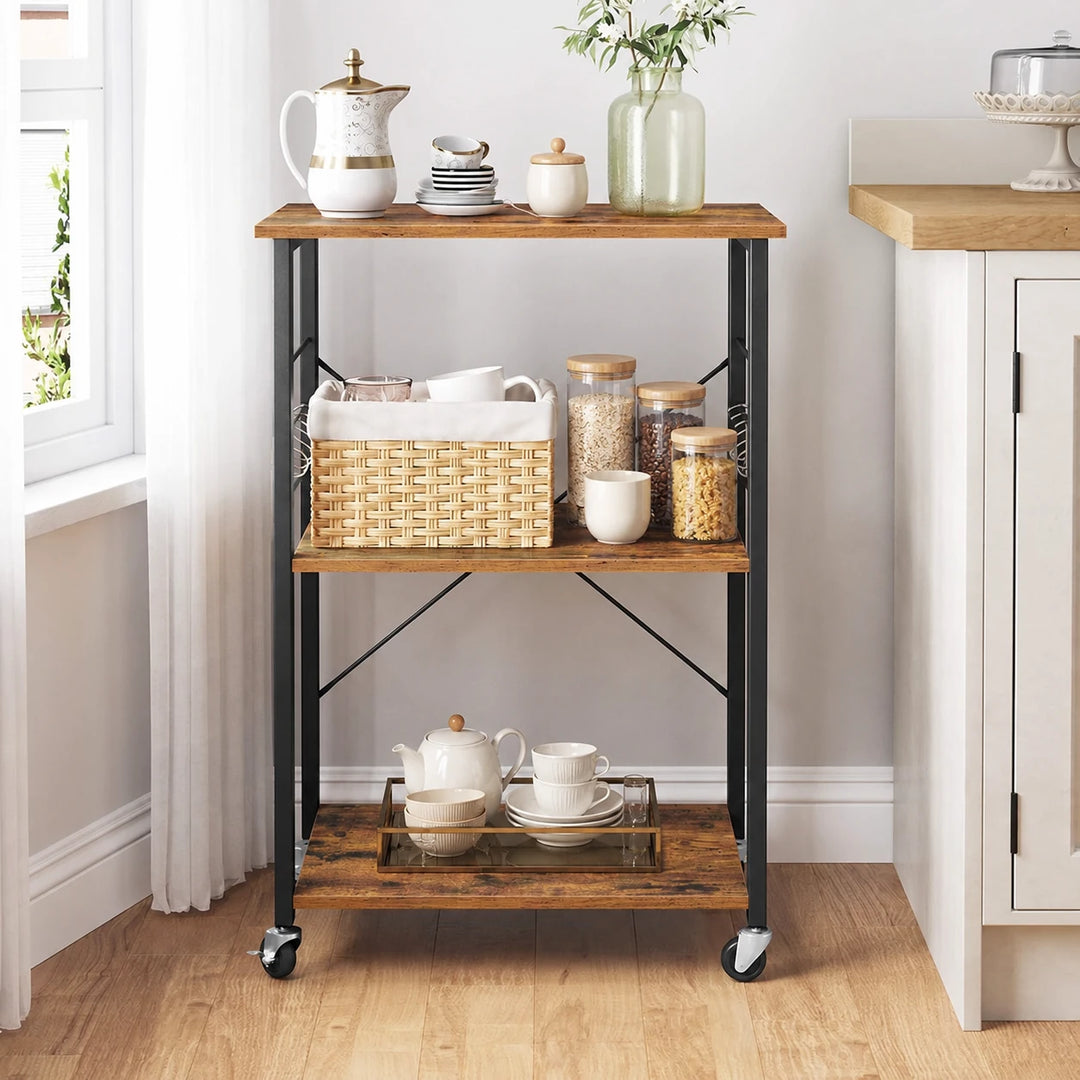 Three-shelf rolling cart with a dark frame, staged with pantry jars and tea cups beside a window