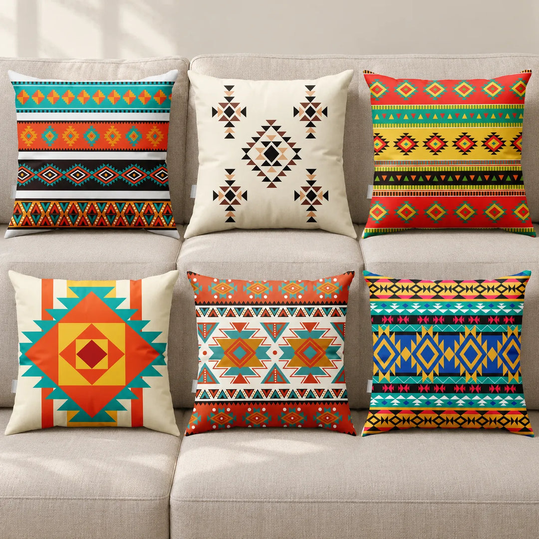 Six Selvina cushion covers with their distinct colourful geometric prints on a neutral sofa