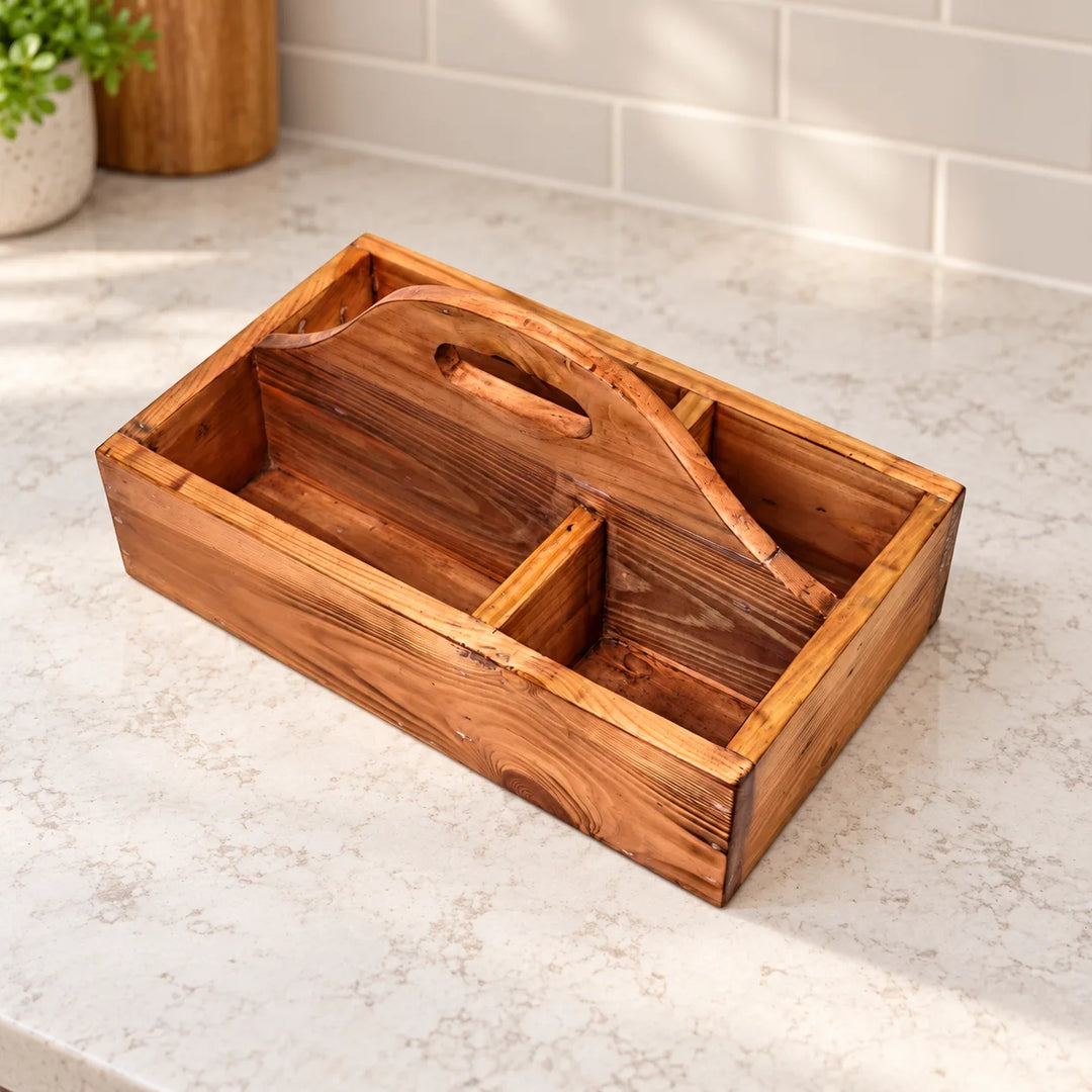Empty Serviette solid wood four-compartment cutlery caddy with carry handle on a neutral kitchen counter