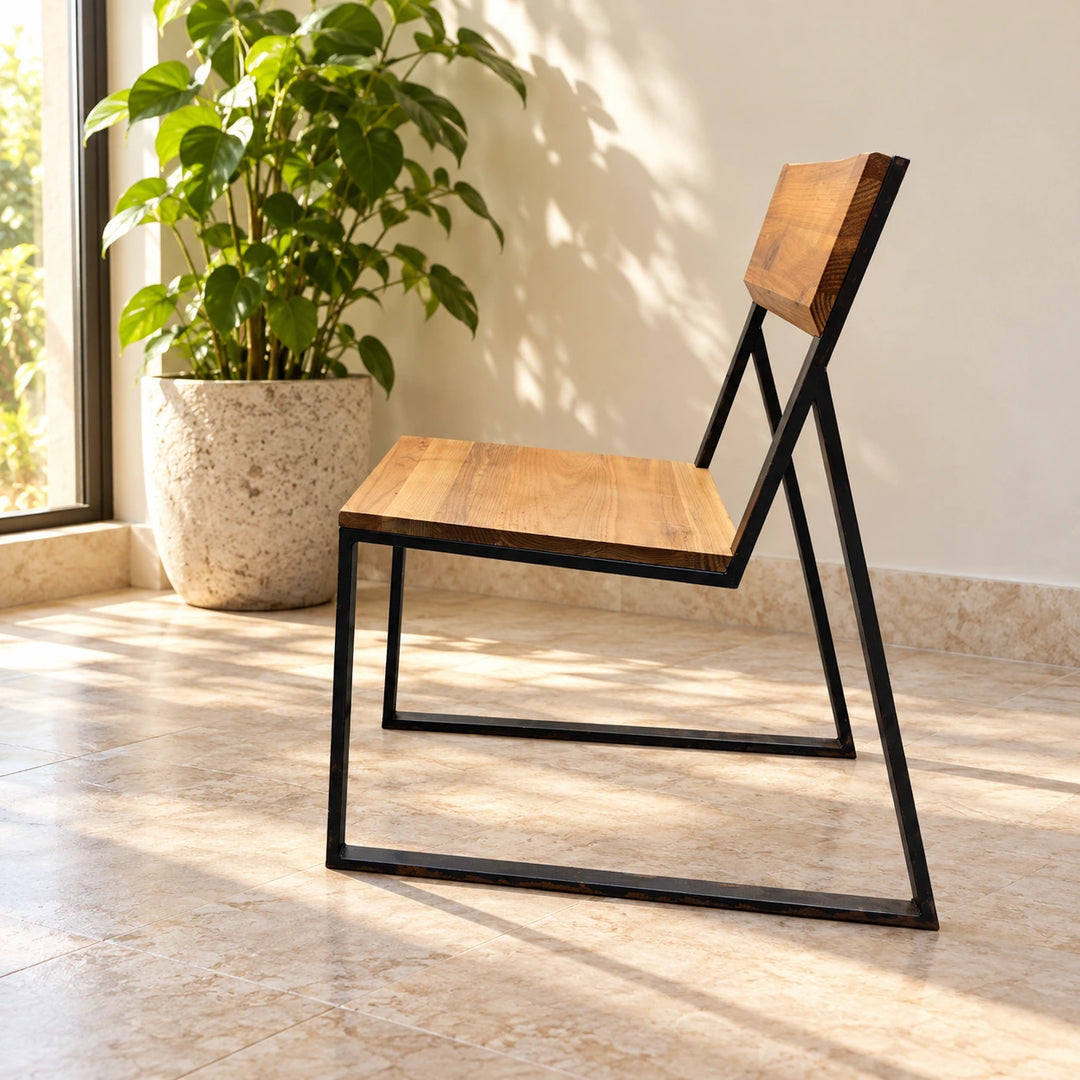 One Signer wood chair with black square-tube sled frame in a sunlit home