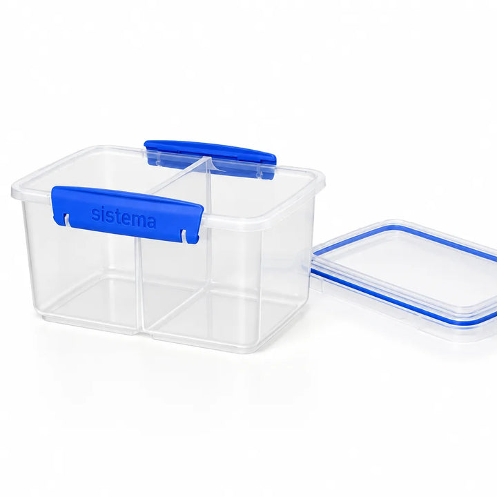 Large clear divided food container with blue clips and its lid beside it
