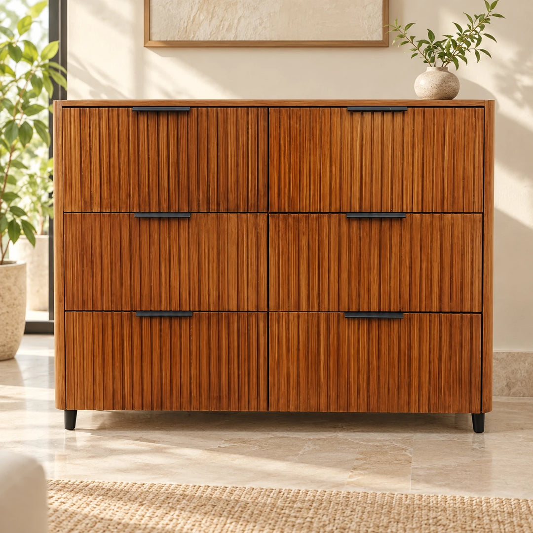 Sleekisin brown fluted six-drawer dresser with black handles in a sunlit room
