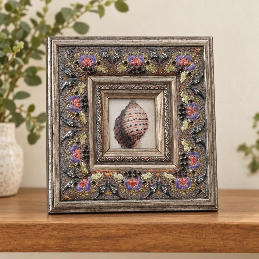 Square floral photo frame with pink rose border on wooden shelf