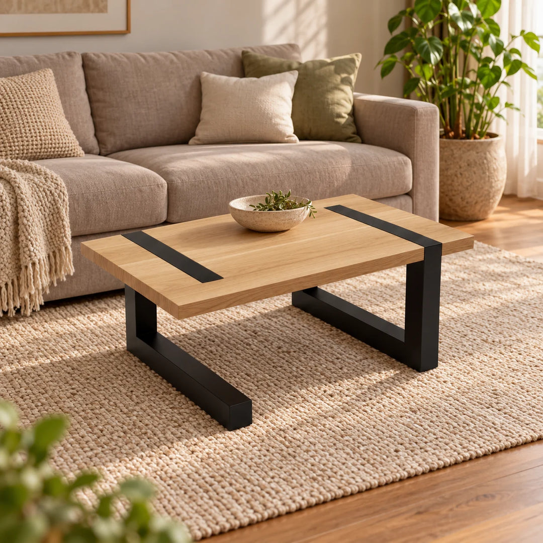 Stahl Holz coffee table with pale top and black metal straps styled in a living room