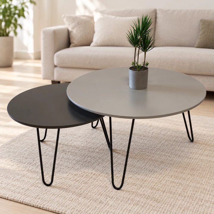 Grey and black nesting tables with hairpin legs in a living room