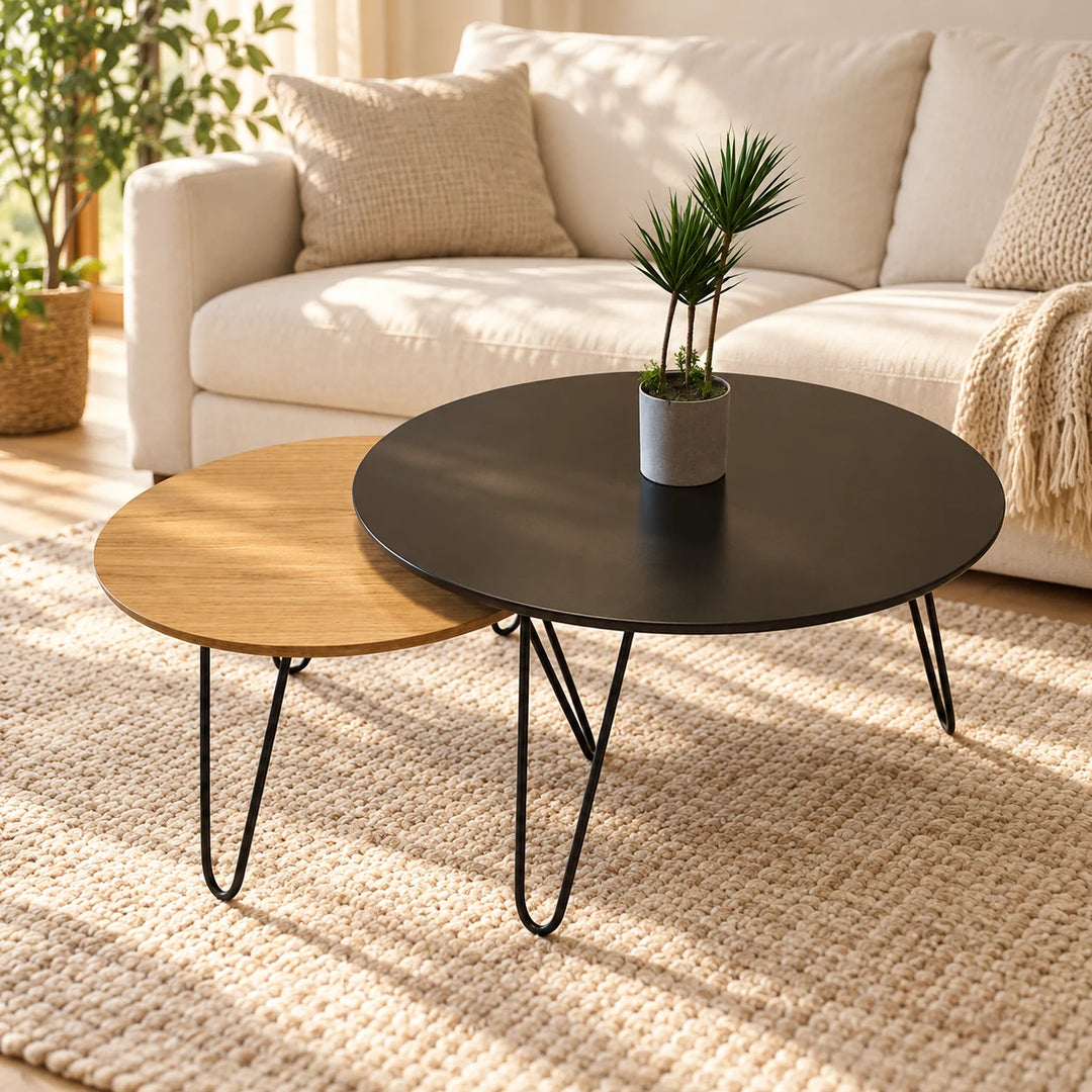 Tatami nesting tables with large black top and smaller oak woodgrain top, black hairpin legs in a sunlit living room