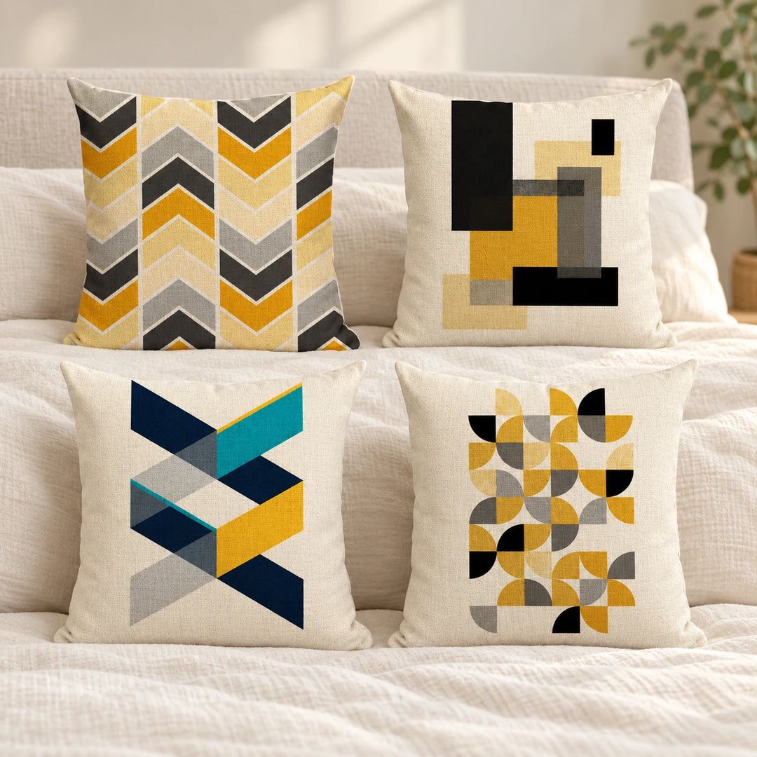 Four Trail cushion covers with multicolour geometric prints on bedding