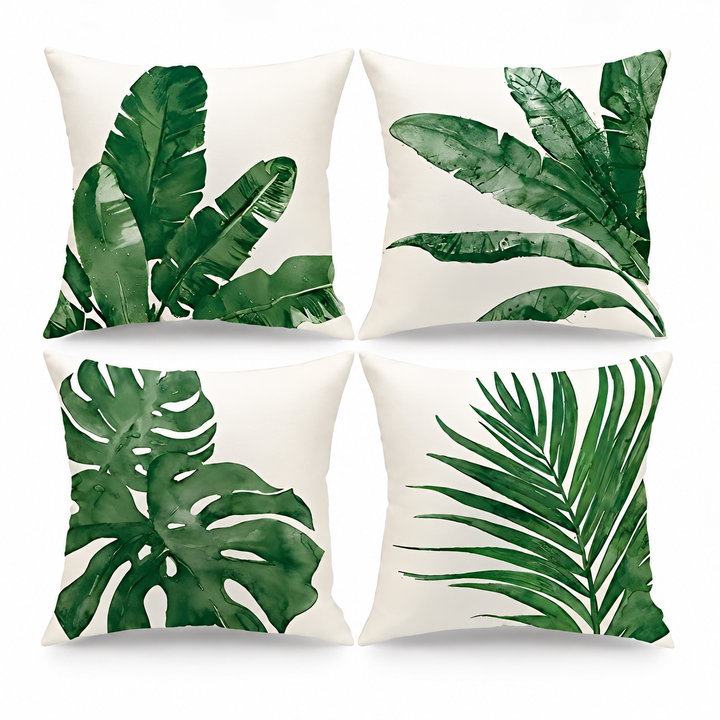 Set of four white cushion covers with green tropical leaf watercolour prints