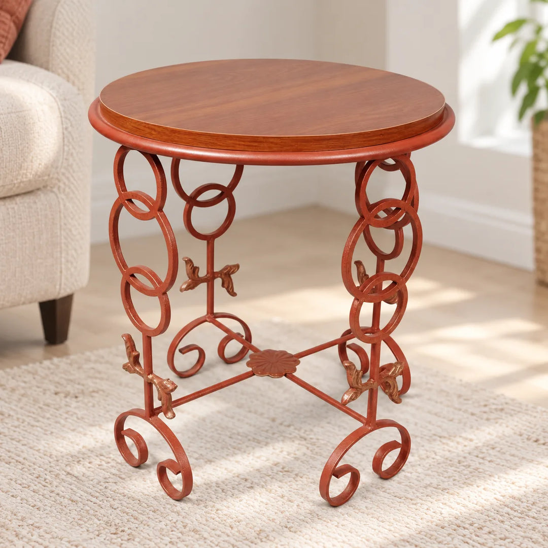 Veltrix Rose Orange side table with wood-grain top, linked-ring metal frame and curled feet in a living room