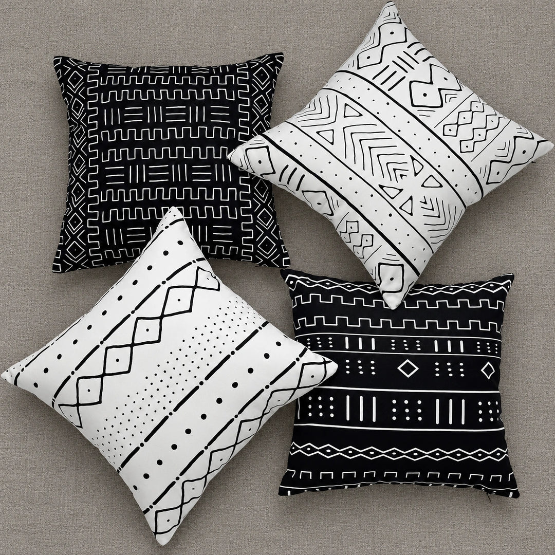 Four black-and-white Virelisse cushion covers arranged on neutral upholstery; covers only, fillers not included.