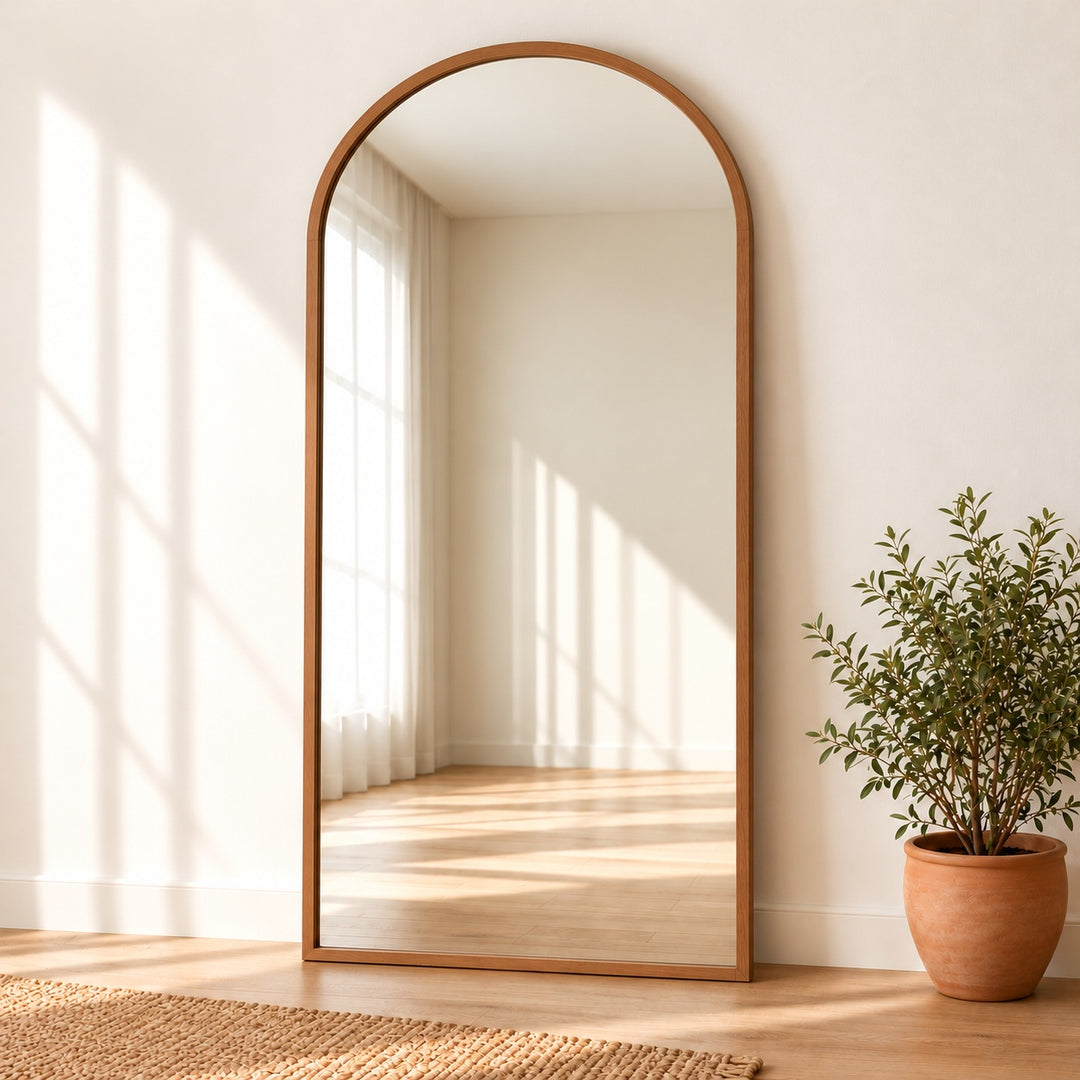 Arched Standing Mirror – Full Length Wooden Floor Mirror in a digitally styled neutral room with greenery.