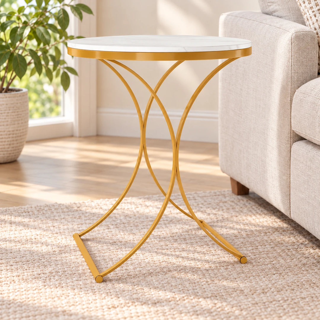 Aurous white marble-effect side table with slim curved Akil Gold powder-coated legs in a sunlit living room