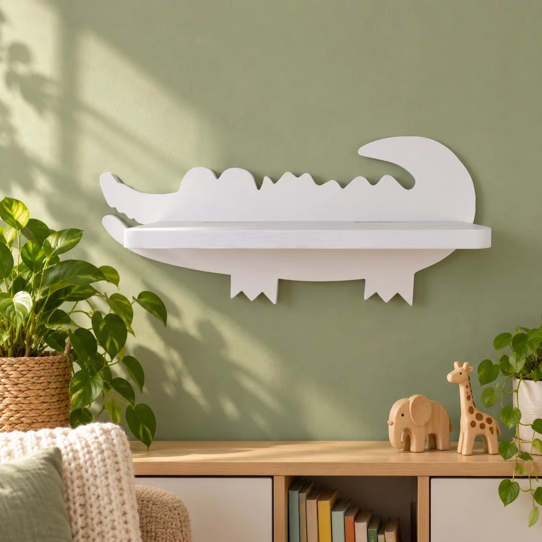 White alligator shaped floating shelf in a styled room with toys and plants