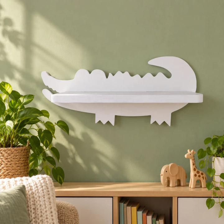White alligator shaped floating shelf in a styled room with toys and plants