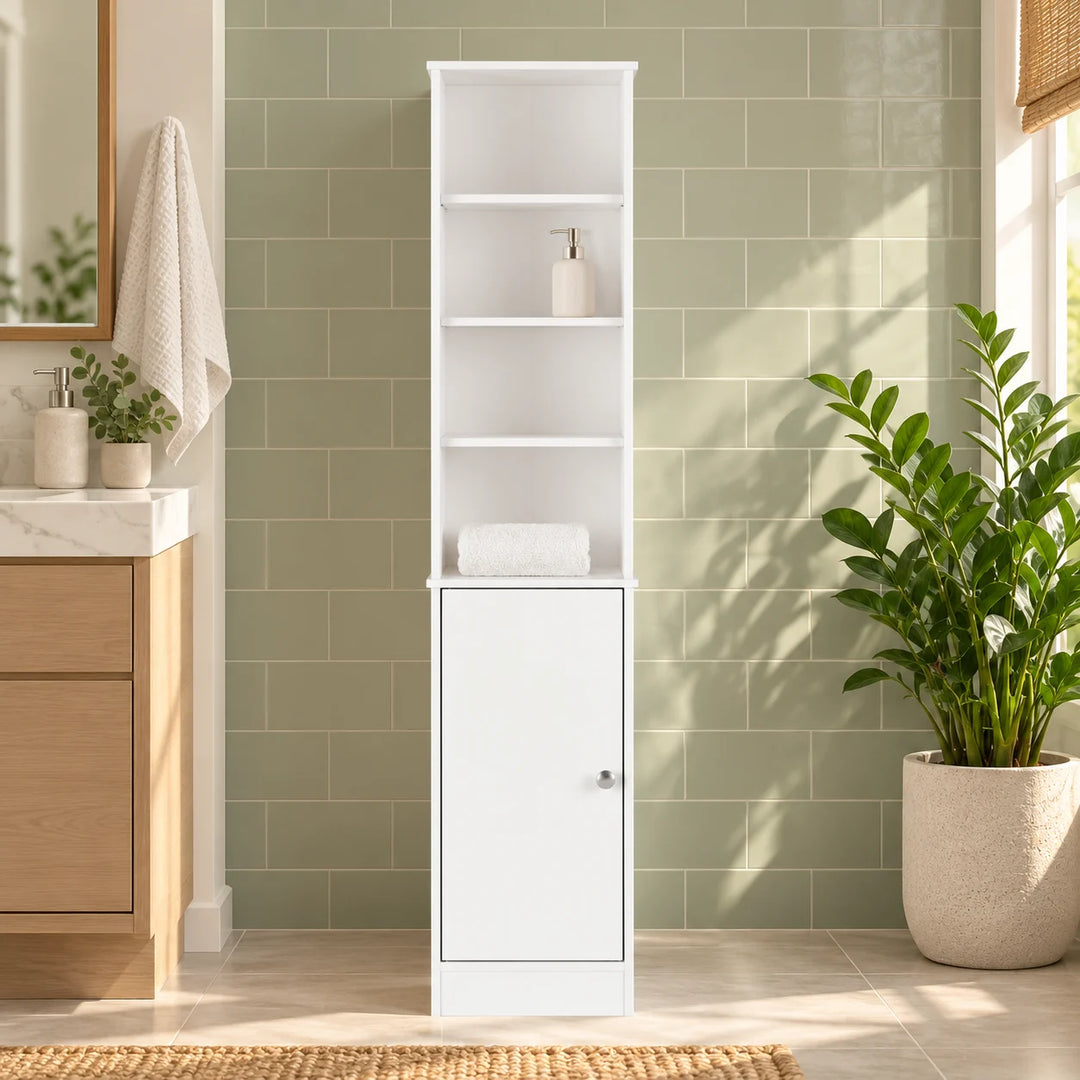 White bathroom storage tower with four open compartments and lower cabinet styled with a plant