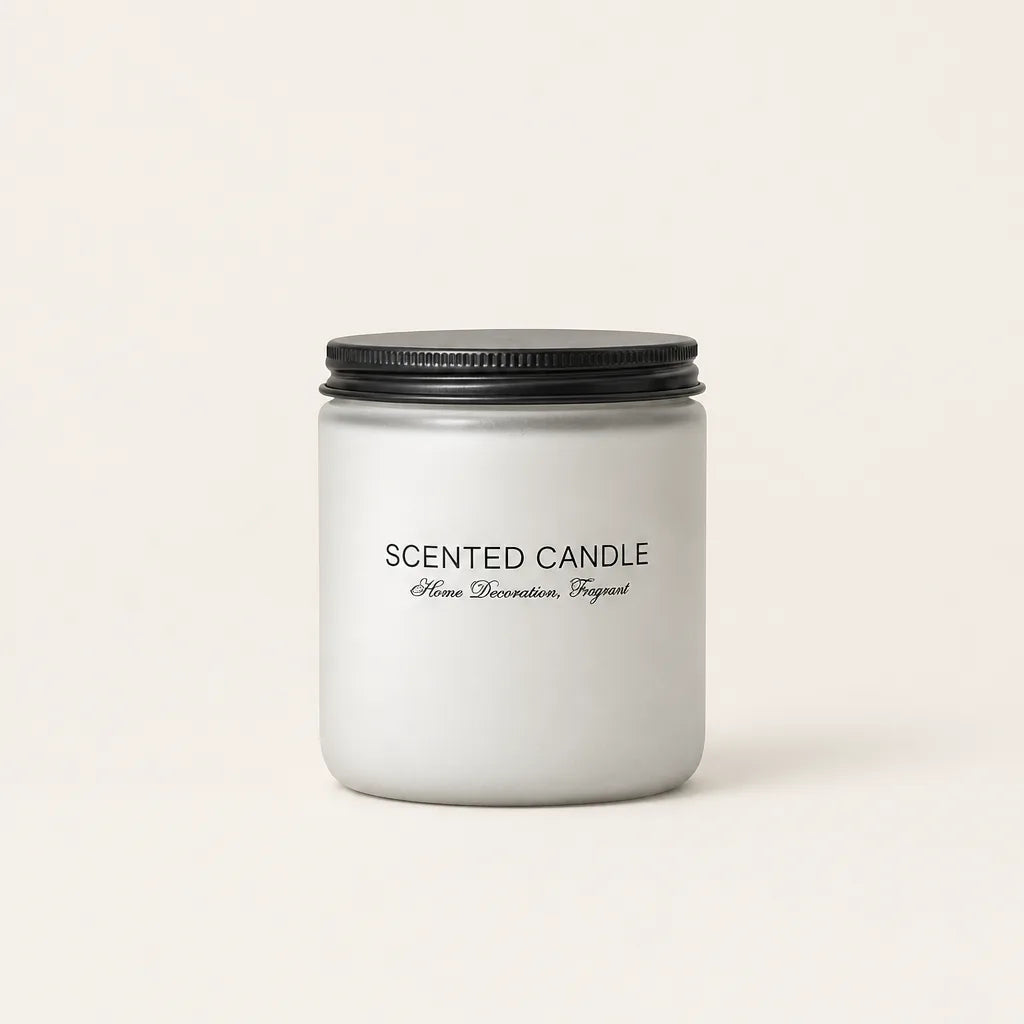 Scented candle in frosted grey glass jar with black lid on white background