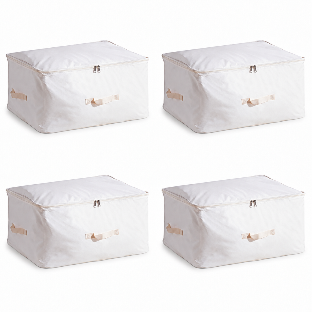 Four matching white zip-top storage boxes with cream front and side handles on a plain pale background.