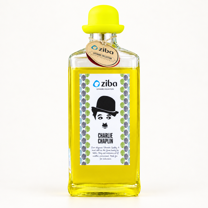 Clear vintage gentleman glass bottle with yellow bowler hat lid, front view on white