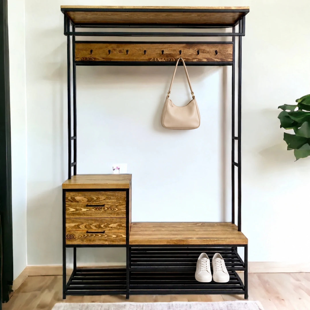 Zingolaz wood and black metal coat rack against a wall with two drawers, shoe shelves, a beige bag and white shoes