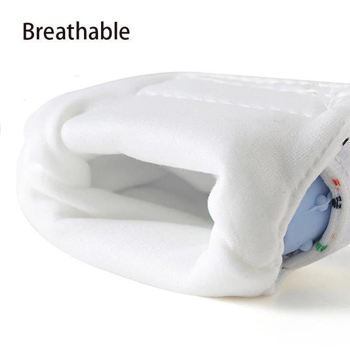 Close-up of breathable white fabric lining inside baby teething mitt