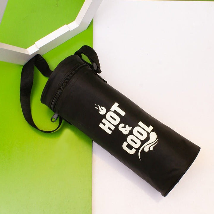 Black insulated thermos storage bag with long shoulder strap lying on white surface