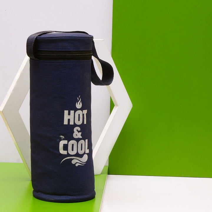 Navy blue thermos storage bag with carry strap standing on green surface